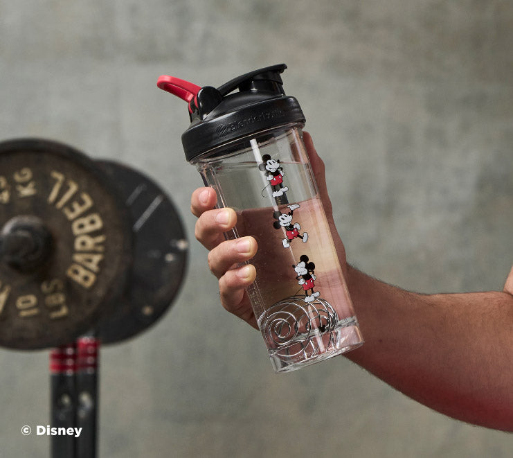 pro-series-b8 Mickey_Mouse_Protein_Shaker_Bottle_Being_Held_In_the_Gym.jpg